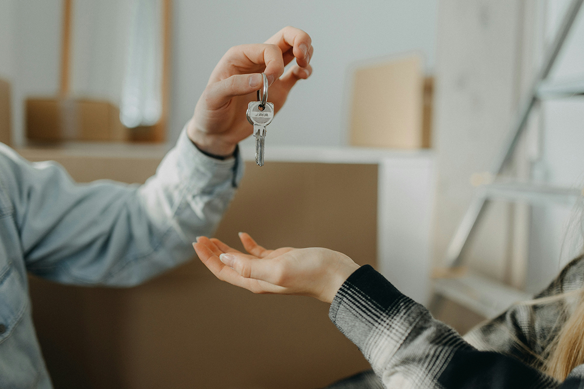 Keys being handed over in a new home